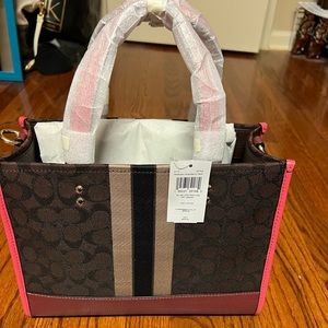 Medium Coach Dempsey handbag- it is no longer in the wrapping.